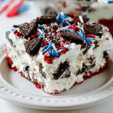 No Bake Fireworks Oreo Cheesecake Bars topped with crushed Oreos