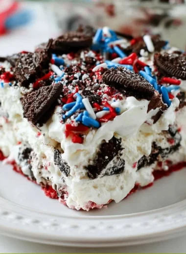 No Bake Fireworks Oreo Cheesecake Bars topped with crushed Oreos