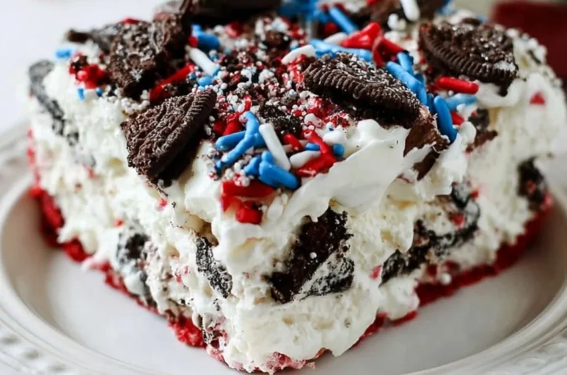 No Bake Fireworks Oreo Cheesecake Bars topped with crushed Oreos