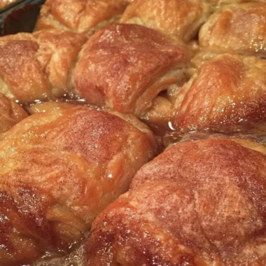 Homemade apple dumplings baked with cinnamon and sugar, a cozy fall treat.