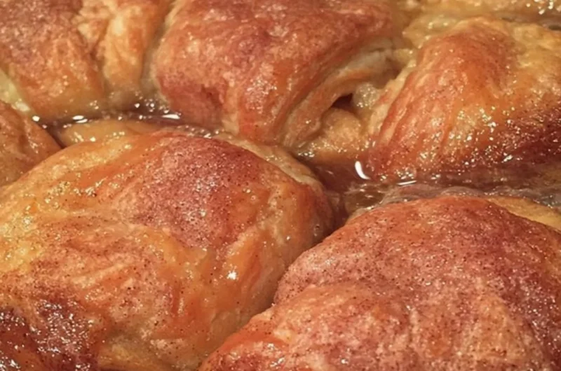 Homemade apple dumplings baked with cinnamon and sugar, a cozy fall treat.