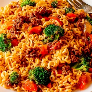 Cozy beef ramen noodles stir fry with vegetables and toppings served in a bowl