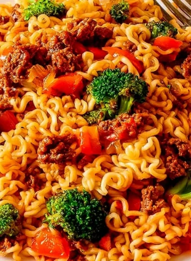 Cozy beef ramen noodles stir fry with vegetables and toppings served in a bowl