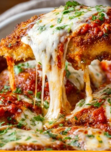 Cozy classic chicken parmesan served with a side of pasta