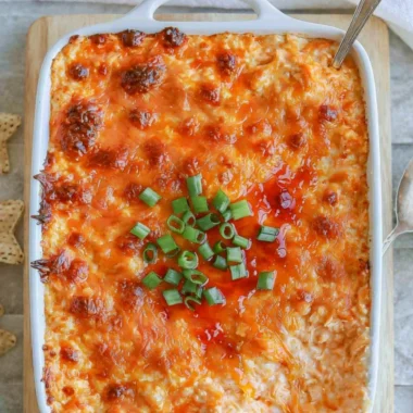 Cozy cottage cheese buffalo chicken dip served in a bowl with tortilla chips