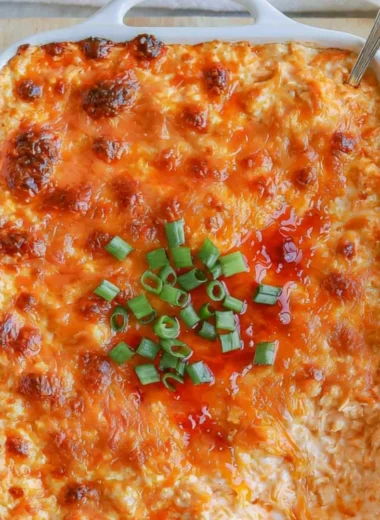 Cozy cottage cheese buffalo chicken dip served in a bowl with tortilla chips