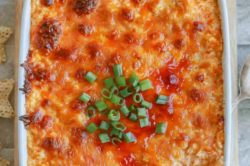 Cozy cottage cheese buffalo chicken dip served in a bowl with tortilla chips