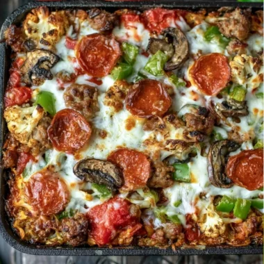 Cozy Low Carb Pizza Casserole with cheese, pepperoni, and vegetables