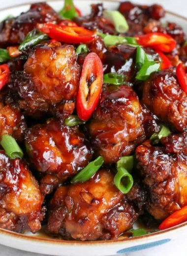 Cozy Mongolian Chicken served in a bowl with vegetables and sauce