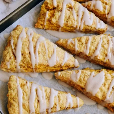Delicious cozy sourdough pumpkin scones topped with spices