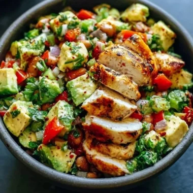 Creamy avocado chicken salad with fresh ingredients in a bowl