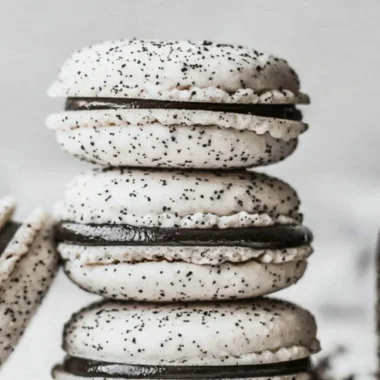 Oreo Macarons with chocolate cream filling on a decorative plate