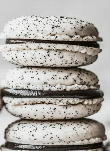 Oreo Macarons with chocolate cream filling on a decorative plate
