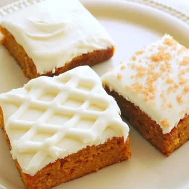 Delicious pumpkin bars with cream cheese frosting on a plate