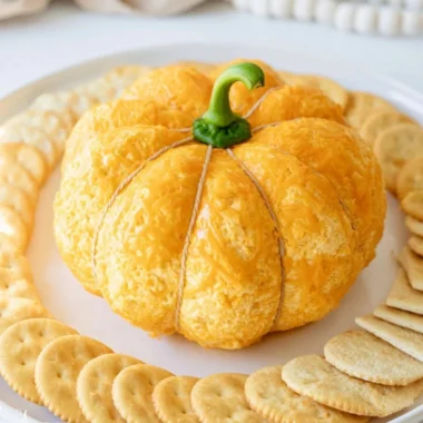 Pumpkin-shaped cheese ball perfect for Halloween and fall festivities