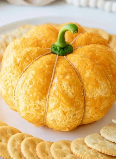 Pumpkin-shaped cheese ball perfect for Halloween and fall festivities