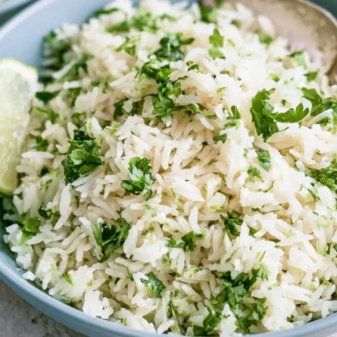 Bowl of cilantro lime rice served in a vibrant dish, capturing Chipotle's famous flavor.