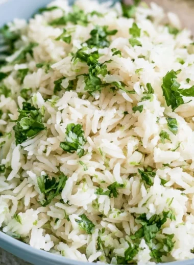 Bowl of cilantro lime rice served in a vibrant dish, capturing Chipotle's famous flavor.