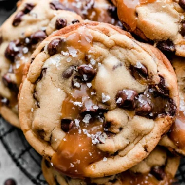 Cozy salted caramel chocolate chip cookies on a rustic table