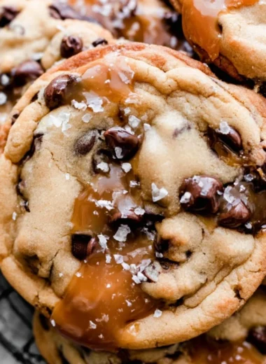 Cozy salted caramel chocolate chip cookies on a rustic table