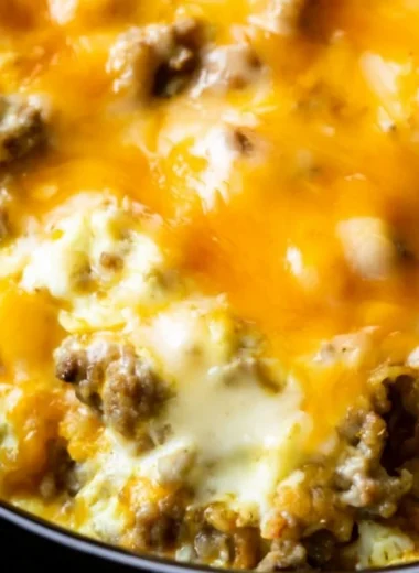 Delicious Cheesy Sausage Hashbrown Breakfast served with eggs