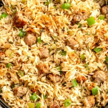 Cozy Cajun dirty rice with sausage in a bowl, showcasing its vibrant flavors.