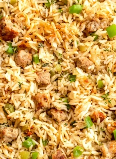 Cozy Cajun dirty rice with sausage in a bowl, showcasing its vibrant flavors.