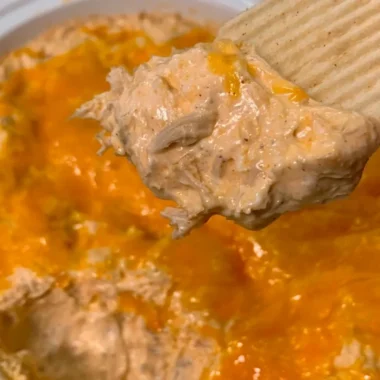 Cozy chicken taco dip served with tortilla chips