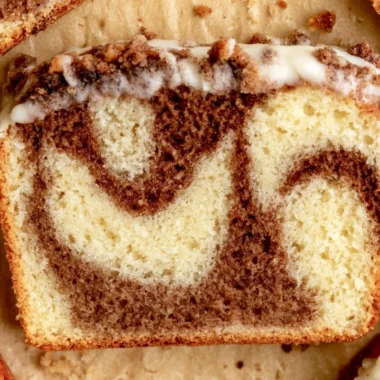 Deliciously baked cozy cinnamon loaf cake garnished with cinnamon sticks.