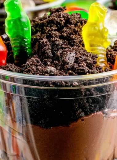 Delicious and fun cozy Dirt Cups dessert with chocolate and gummy worms