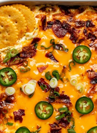 Creamy jalapeno popper dip served in a bowl with chips