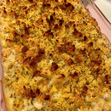 Delicious easy chicken dressing casserole topped with herbs and spices.