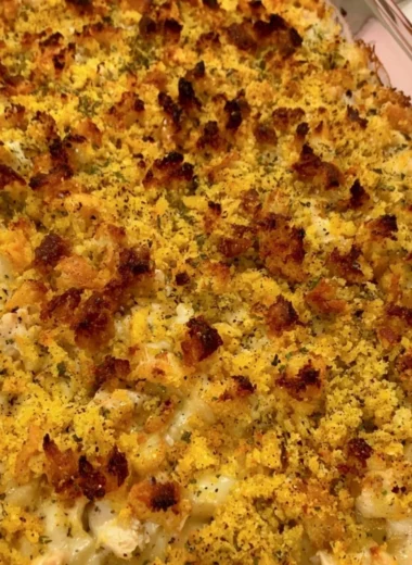 Delicious easy chicken dressing casserole topped with herbs and spices.