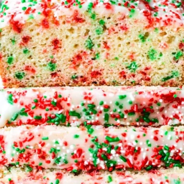 Sliced festive Christmas sprinkle buttermilk bread decorated with colorful sprinkles.