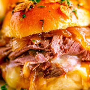 Delicious French Dip Sliders with tender beef and melted cheese