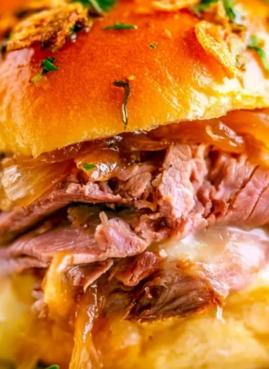 Delicious French Dip Sliders with tender beef and melted cheese