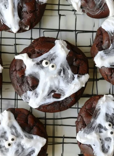 Delicious Halloween double chocolate spider web cookies decorated with icing.