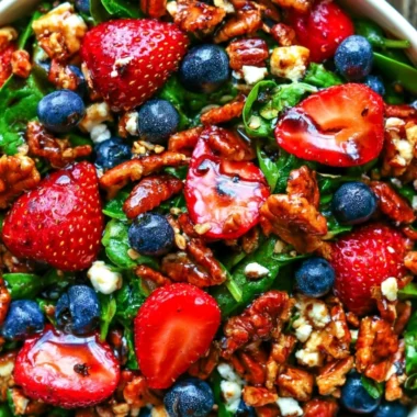 Delicious strawberry spinach salad with blueberries, pecans, and feta cheese