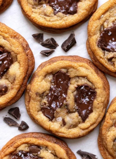 Freshly baked brown butter chocolate chip cookies on a cooling rack