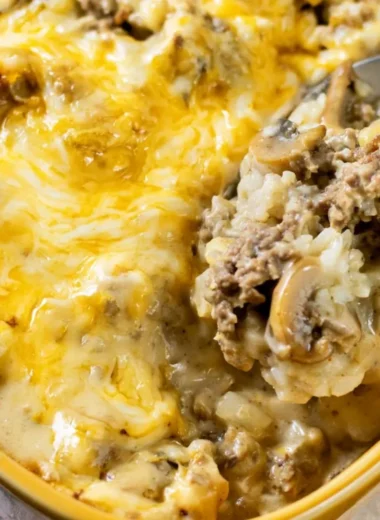 Cheesy ground beef and rice casserole served in a dish